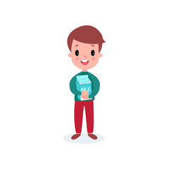Cute smiling boy holding cardboard box of milk, healthy food for kid cartoon vector illustration