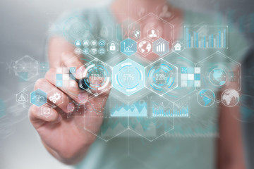 Businesswoman using holograms datas on digital screens with a pen 3D rendering