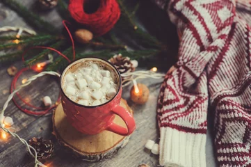 Foto op Canvas christmas table top view with hot cocoa, warm knitted sweater and garland. Cozy winter morning at home © mashiki