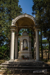 Old antique statue of the Virgin Mary in the park at Villa Doria-Pamphili in Rome, Italy