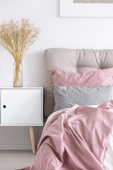 White wooden chest in bedroom