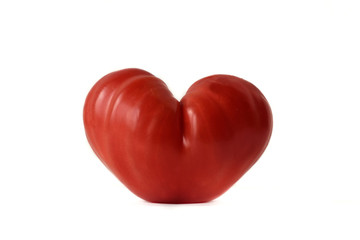 Heart shaped tomato on white background- Love concept