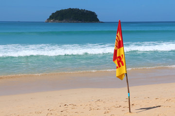 Fototapeta na wymiar Swim here. Safety flag on the Kata beach