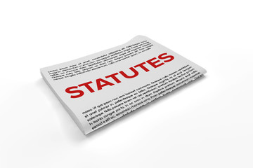 Statutes on Newspaper background