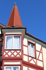 Romantic spire of a half-timbered house against blue sky (Meersburg, Lake Constance, Germany)