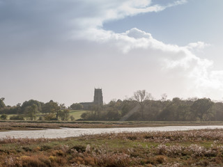 beautiful coast landscape scene with english church on horizon Alresford