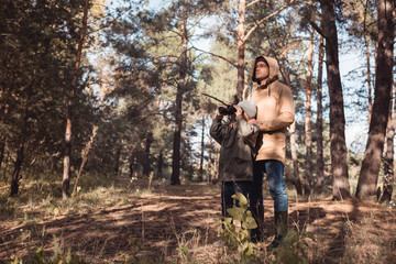 father and son with binoculars
