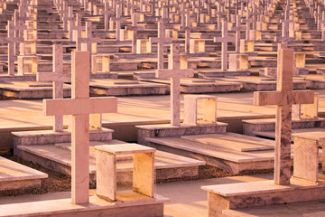 The Art of alternative positive sunrise view to the death and marble crosses at the cemetery