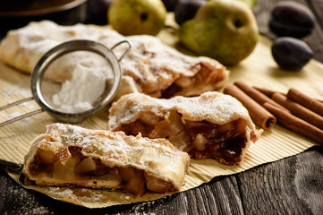 Strudel with pear, plums and cinnamon.