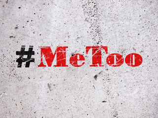 Hashtag Metoo illustration on concrete wall as trending social-media movement against sexual harassment 