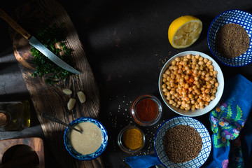 Ingredients for cooking falafel, chickpeas, tahini and spices closeup