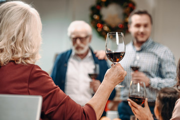 woman making toast on christmas