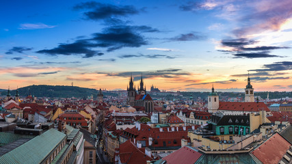 Fototapeta premium Panorama of Prague with red roofs from above summer day at dusk, Czech Republic