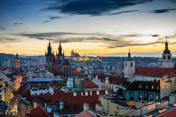 Obraz premium Aerial view over Church of Our Lady before Tyn, Old Town and Prague Castle at sunset in Prague, Czech Republic