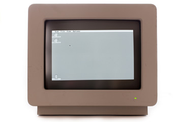 Vintage computer monitor display. Retro cathode ray tube monochrome screen monitor showing floppy disk drive icons and trash can.