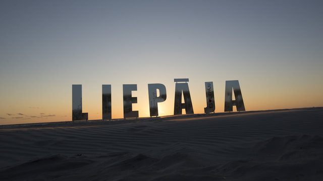 Beatiful sign Leipaja on Leipaja beach at sunset