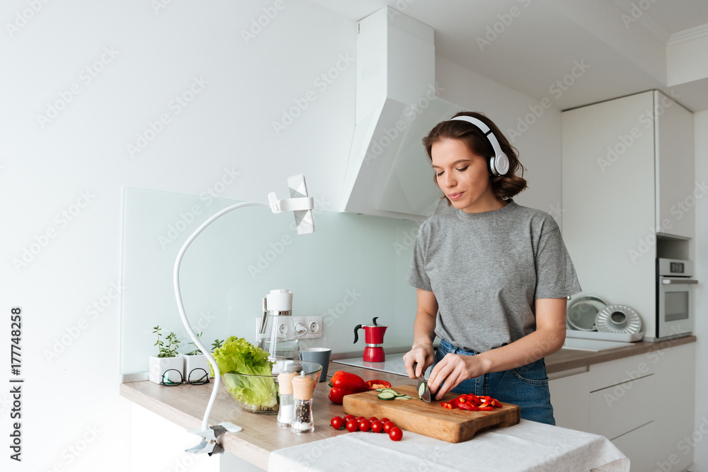 Canvas Prints Portrait of a pretty young woman listening to music