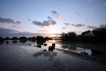 Naklejka premium A river and the setting sun after the typhoon.