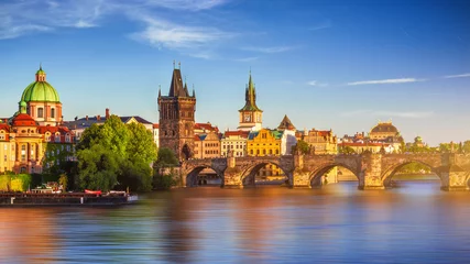 Fototapeten Scenic spring sunset aerial view of the Old Town pier architecture and Charles Bridge over Vltava river in Prague, Czech Republic © daliu