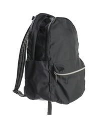 Black backpack isolated on white background.