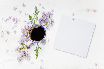 Coffee and purple lilac and white paper card