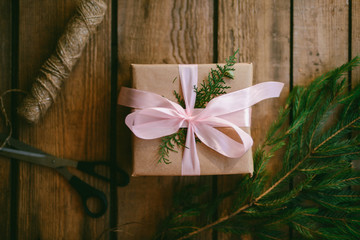 Lots of Gift boxes on wooden background. Presents in craft  paper decorated with  ribbon. Christmas and other holidays concept.