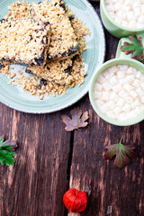 Two cup of coffee or hot chocolate with marshmallow near knitted blanket and pie. Autumn concept. Christmas. Top view.