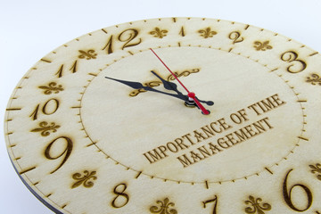 Wooden round wall watch - clock isolated on white background. Manage your time