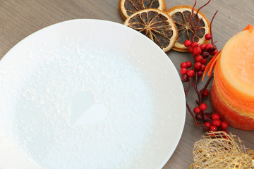 Christmas decoration background with white plate on wooden background