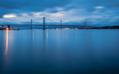 Obraz premium Forth Road Bridges at Night / Queensferry Crossing a road bridge in Scotland, built alongside the existing Forth Road Bridge across the Firth of Forth between South and North Queensferry