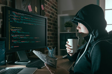beautiful programmer hacker drinking hot coffee