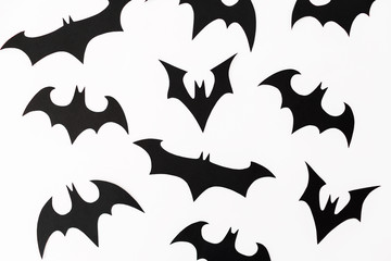 Fototapeta premium Halloween homemade paper black bats isolated on white background. Flat lay, top view.