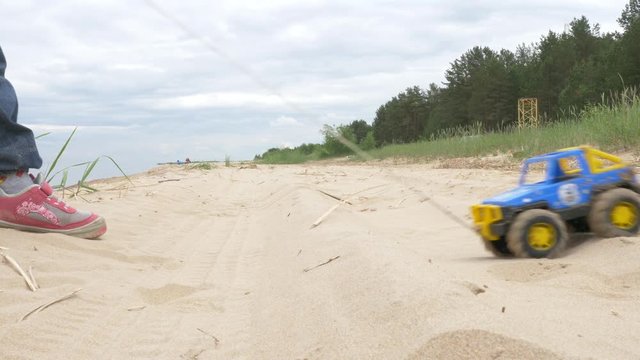 sand therapy. the child plays with the sand. Toys in the sand of the sea