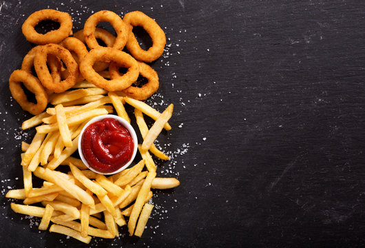 onion rings and french fries with ketchup