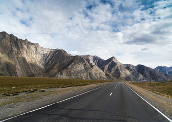 asphalted road with markings in the mountains