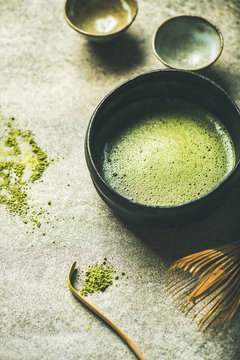 Flat-lay of freshly brewed Japanese matcha tea in Chasen bowl, selective focus
