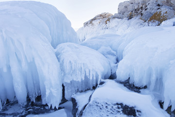 Icicles in Borga-Dagan island rock. Winter landscape
