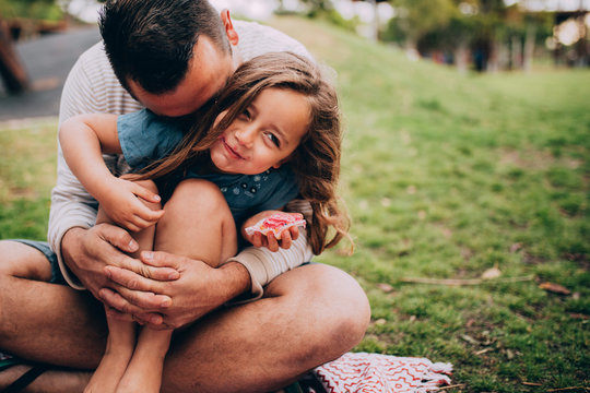 Father and daughter at picnic in park