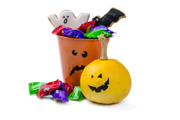 Halloween concept - basket with candies and ccokies