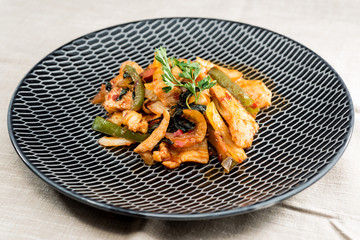 wok fried chicken stir fry with sweet peppers and chinese vegetables