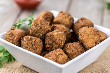 Meatballs (fresh made) as detailed close-up shot, selective focus)