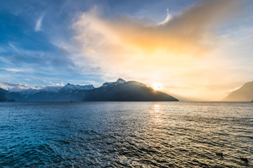 The sunset is burning. Bright fantastic sunset over the Alpine ridge and Lake Lucerne.