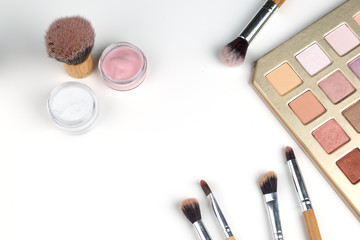 beauty concept : cosmetics top view on a white table. Workplace, cosmetic bag