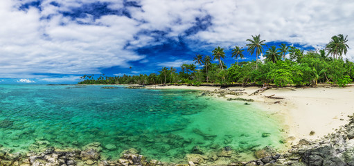 Tropical beach on south side of Upolu, Samoa Island with palm trees
