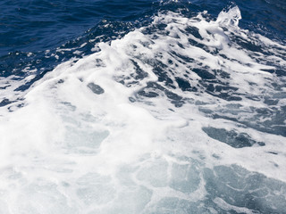 blue sea water forms a wave