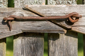 Old Metal lock on wooden fence