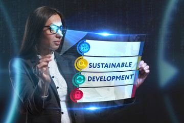 The concept of business, technology, the Internet and the network. A young entrepreneur working on a virtual screen of the future and sees the inscription: Sustainable development