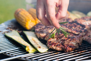 meat and vegetables on the grill