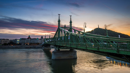 Budapest, Hungary - The beautiful Liberty Bridge at sunset with amazing colorful sky and clouds