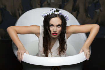 Sexy brunette maniacal woman getting out of bath.